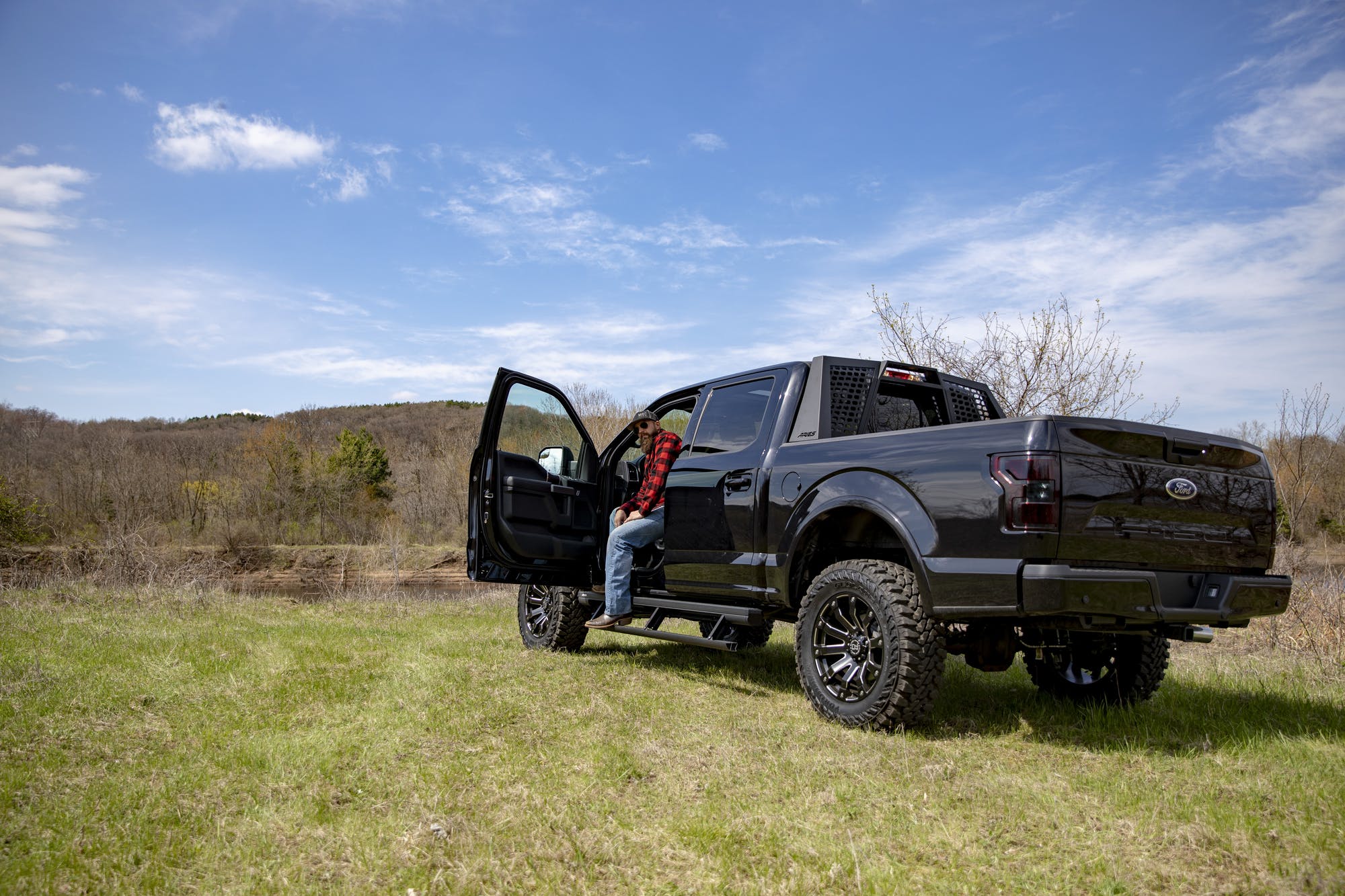 Black F150 exterior rear view aftermarket tires